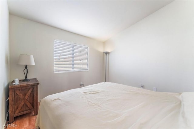 bedroom with hardwood / wood-style floors