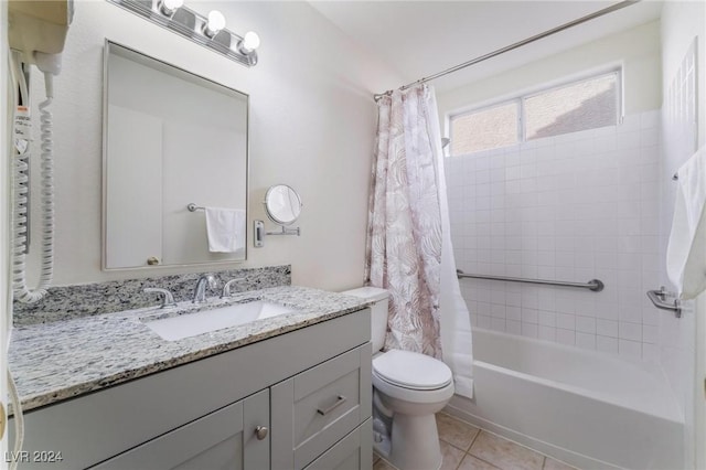 full bathroom featuring tile patterned floors, vanity, toilet, and shower / bathtub combination with curtain