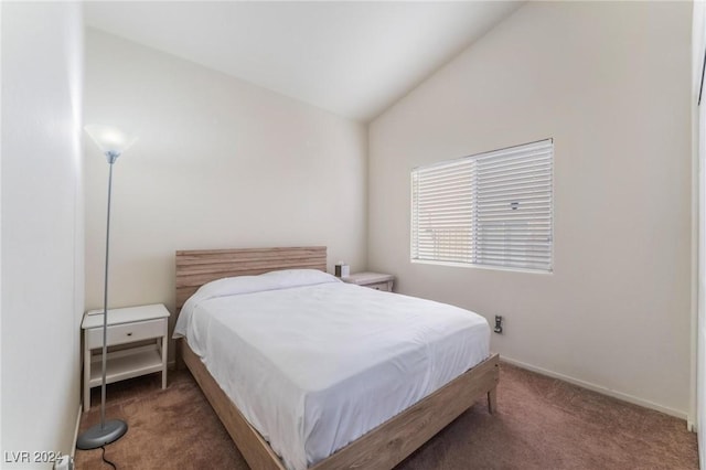 bedroom featuring carpet and vaulted ceiling