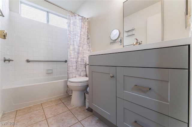 full bathroom with tile patterned flooring, shower / bath combo, vanity, and toilet