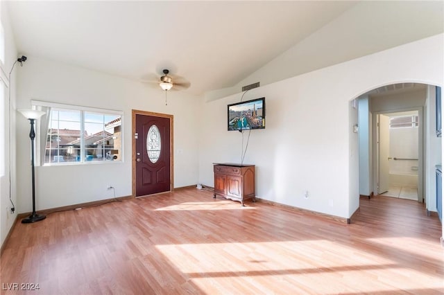 entryway featuring ceiling fan, light wood-type flooring, and lofted ceiling