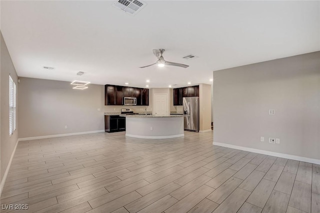 unfurnished living room with ceiling fan