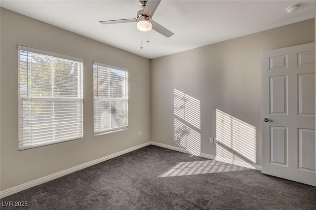 carpeted spare room with ceiling fan