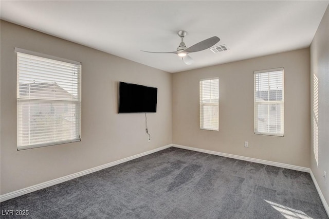 unfurnished room featuring ceiling fan and carpet floors