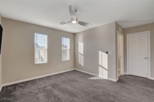 carpeted empty room featuring ceiling fan