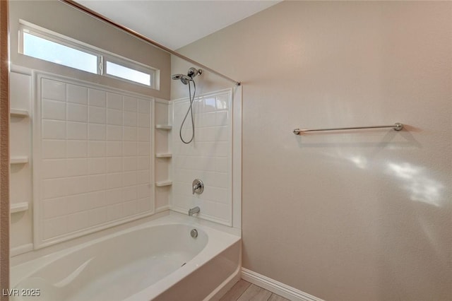 bathroom featuring wood-type flooring and bathing tub / shower combination