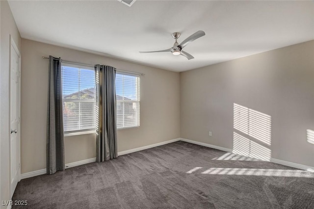 unfurnished room with ceiling fan and carpet floors