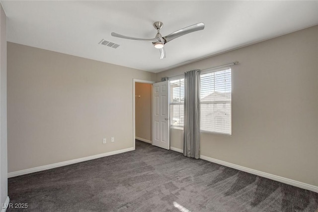 unfurnished bedroom featuring ceiling fan and dark colored carpet