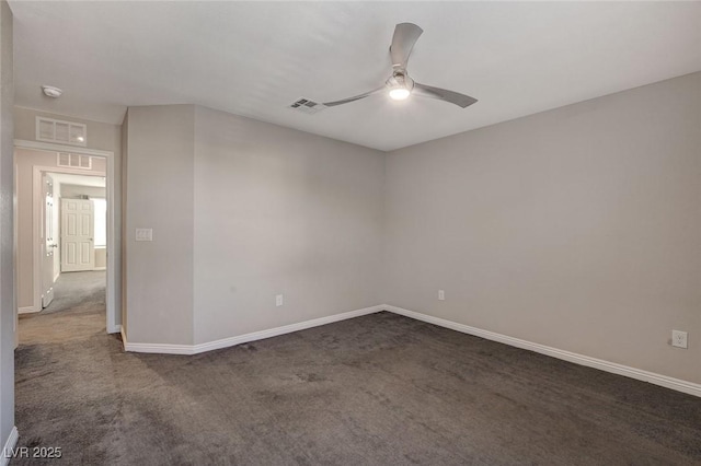 carpeted spare room featuring ceiling fan