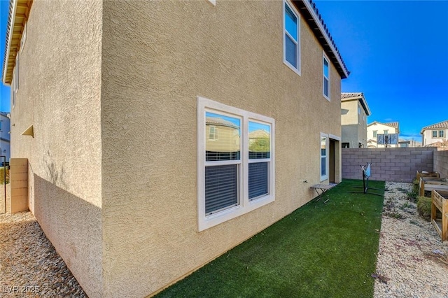 view of home's exterior featuring a yard