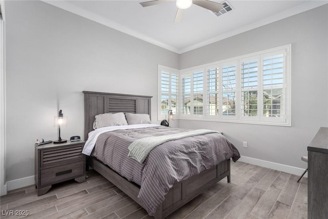 bedroom featuring ceiling fan, light hardwood / wood-style flooring, and ornamental molding