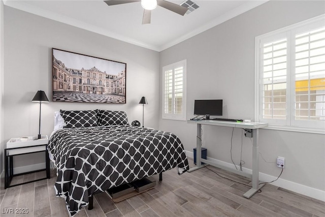 bedroom with light hardwood / wood-style flooring, ceiling fan, and crown molding