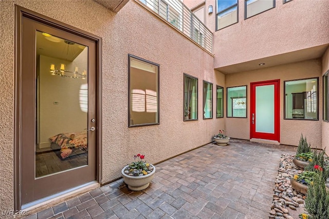 doorway to property featuring a patio area