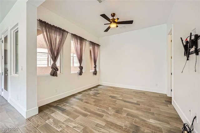 unfurnished room with wood-type flooring and ceiling fan