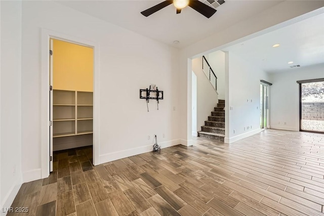 interior space featuring ceiling fan and wood-type flooring