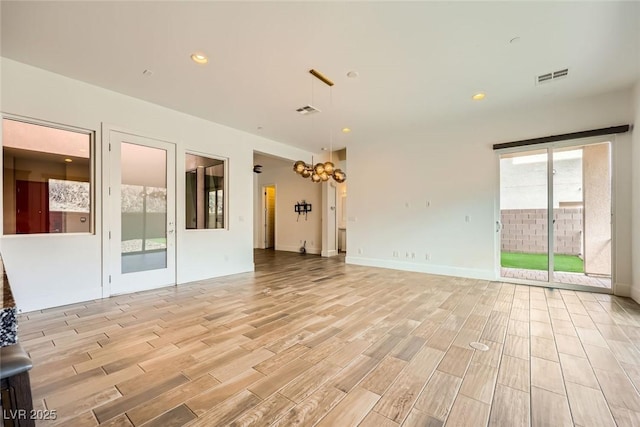 unfurnished living room featuring light hardwood / wood-style flooring