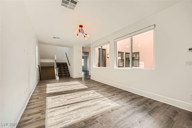 unfurnished living room with hardwood / wood-style flooring