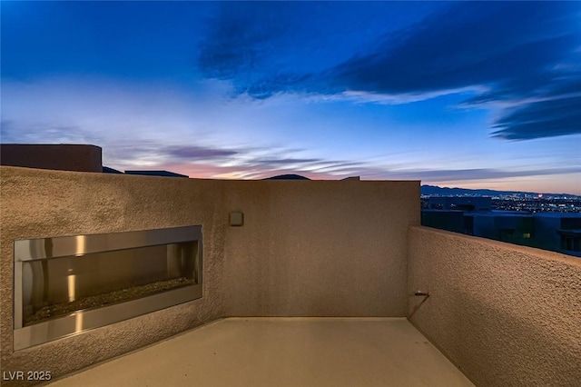 view of patio terrace at dusk