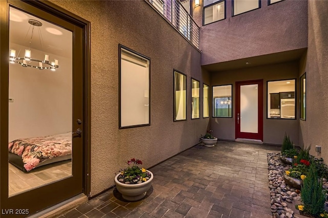 entrance to property with a patio