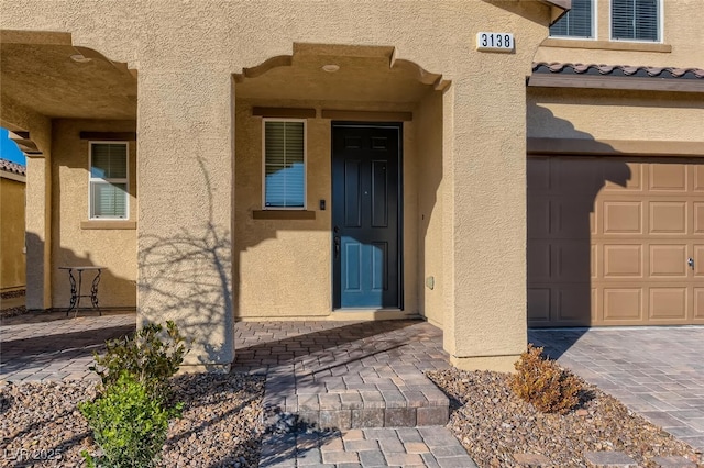 property entrance featuring a garage