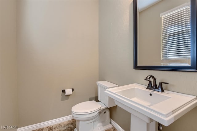 bathroom featuring toilet and sink