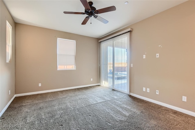 spare room with carpet floors, ceiling fan, and a healthy amount of sunlight