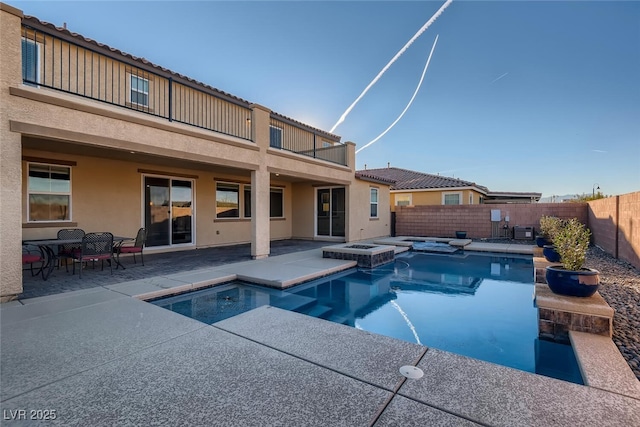 view of swimming pool with an in ground hot tub and a patio