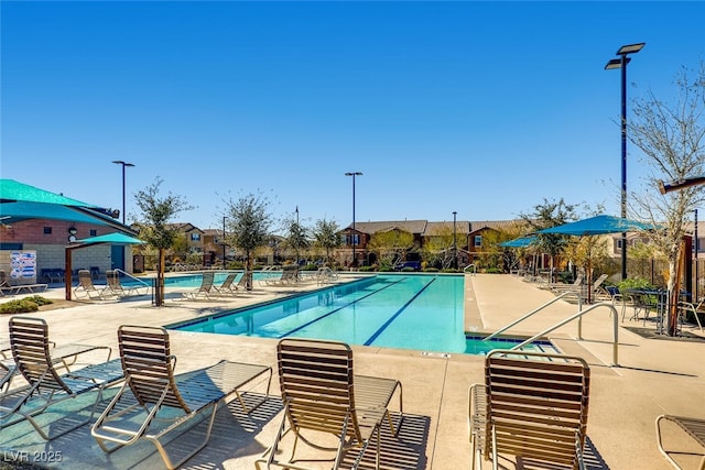 view of swimming pool featuring a patio