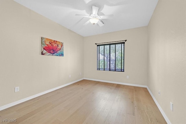 empty room featuring ceiling fan and light hardwood / wood-style flooring