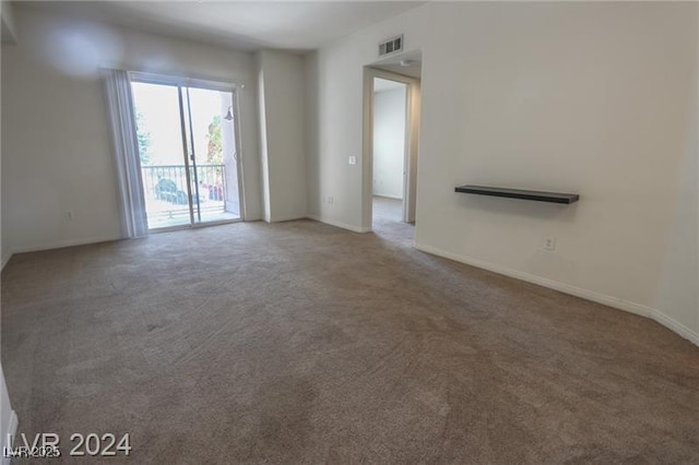 unfurnished living room featuring carpet