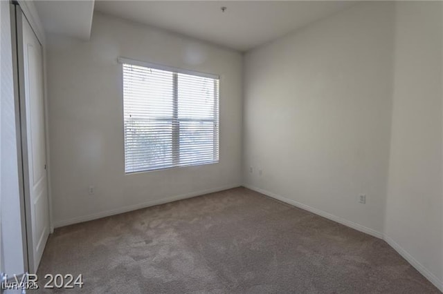 empty room featuring carpet flooring