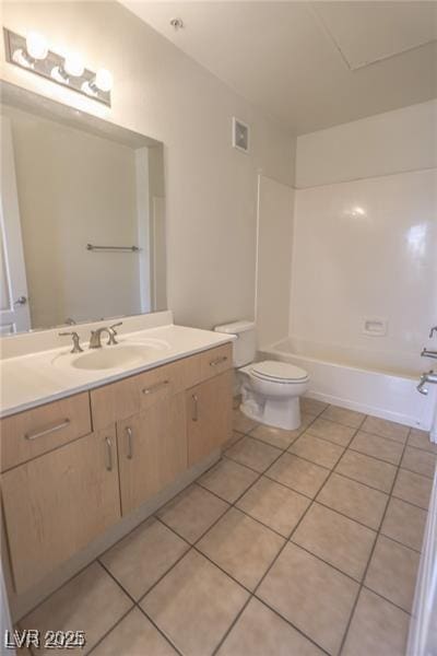 full bathroom with tile patterned flooring, vanity, toilet, and tub / shower combination