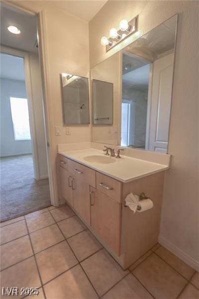 bathroom featuring tile patterned flooring and vanity