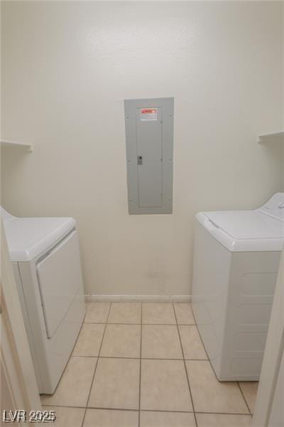 washroom with light tile patterned floors, independent washer and dryer, and electric panel