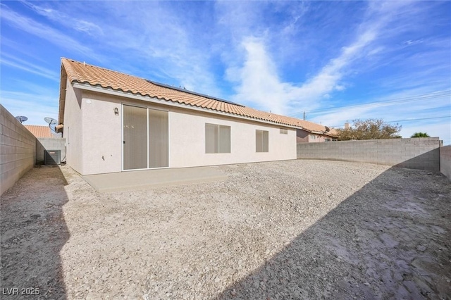 back of property featuring central AC unit