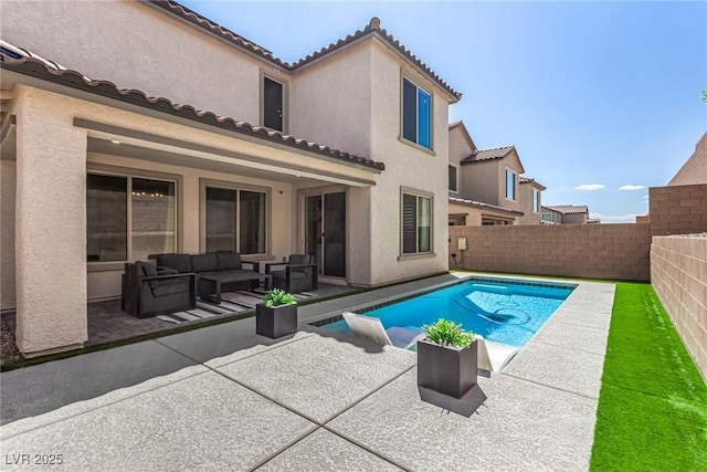 view of pool with an outdoor living space and a patio area