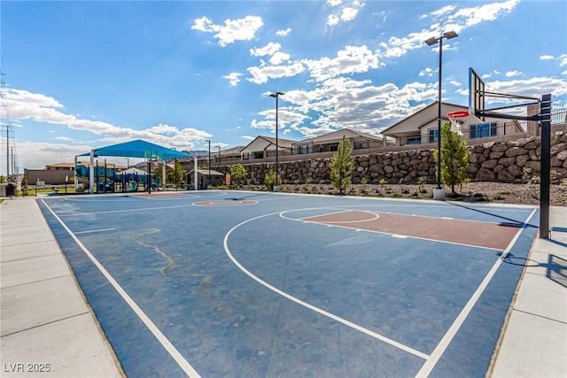 view of sport court with a playground