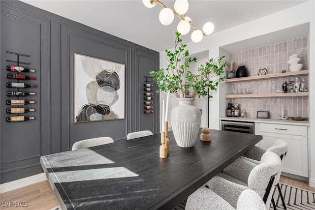 dining room with bar area and wine cooler