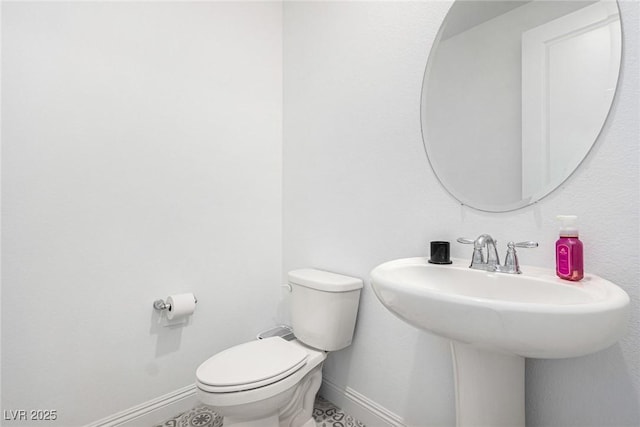 bathroom featuring toilet and sink