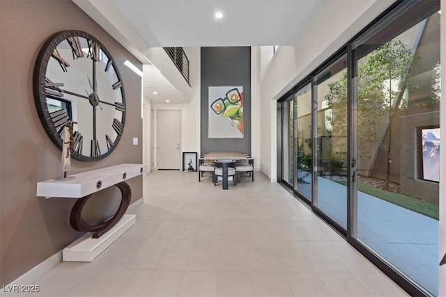 hallway with recessed lighting, visible vents, and baseboards