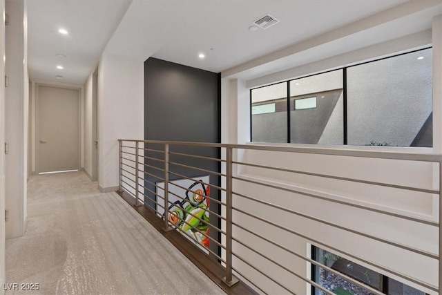 hallway with visible vents and recessed lighting