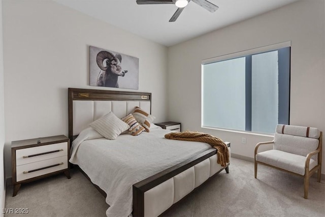 bedroom featuring light carpet and ceiling fan