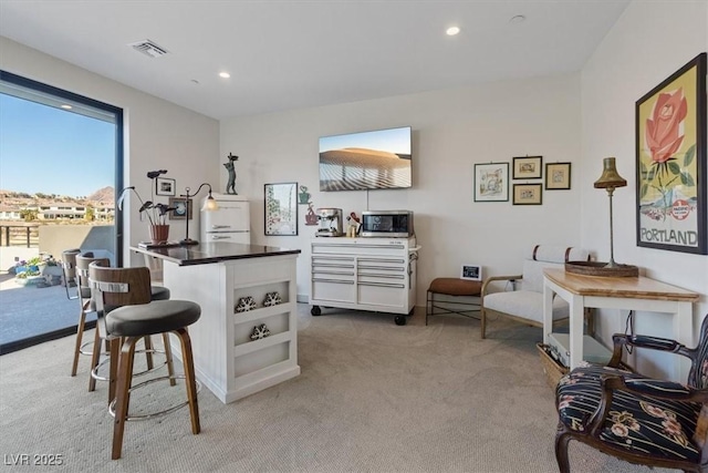 interior space featuring light colored carpet, white cabinets, recessed lighting, and open shelves