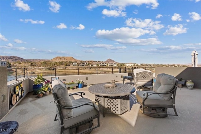 view of patio / terrace with a mountain view