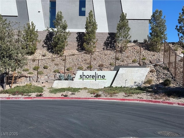 community sign featuring fence