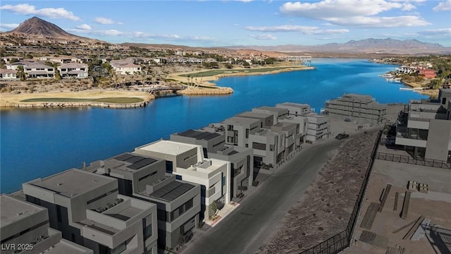 birds eye view of property featuring a residential view and a water and mountain view