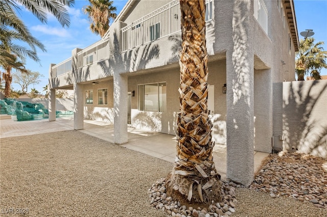 exterior space with a patio area and a balcony