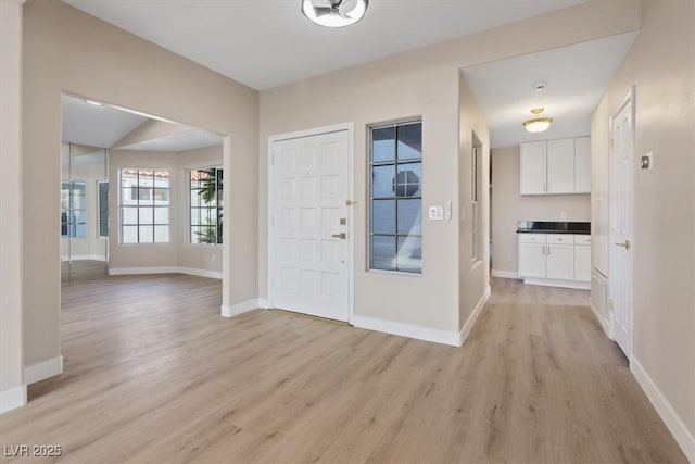 entrance foyer with light wood-type flooring