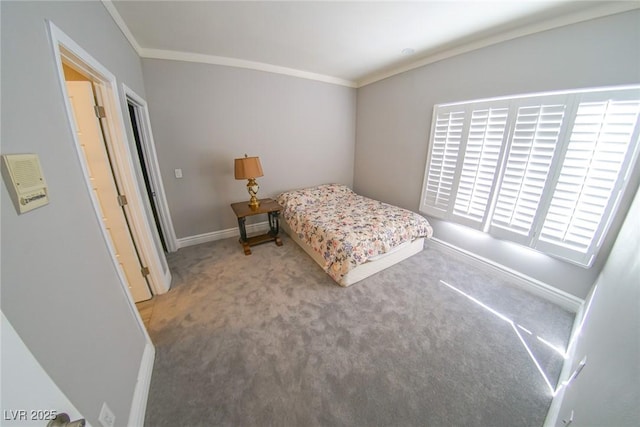 bedroom featuring crown molding and carpet