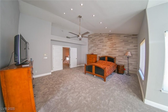 bedroom with lofted ceiling and light colored carpet